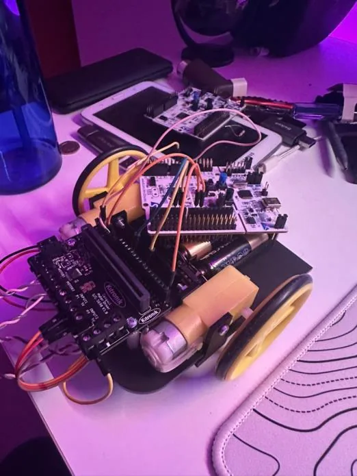 The line-following buggy with its STM32 board and wiring