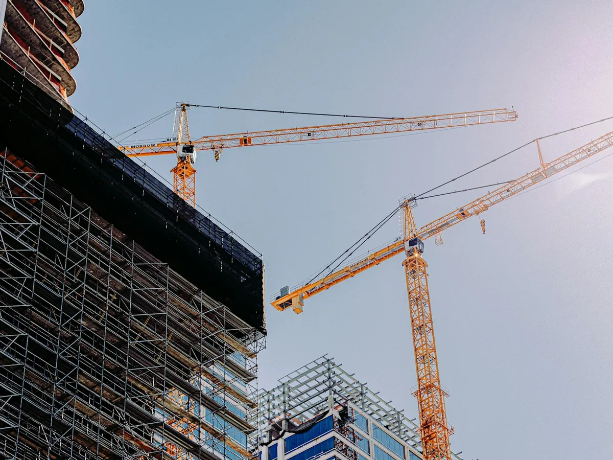 Tower cranes over a building under construction