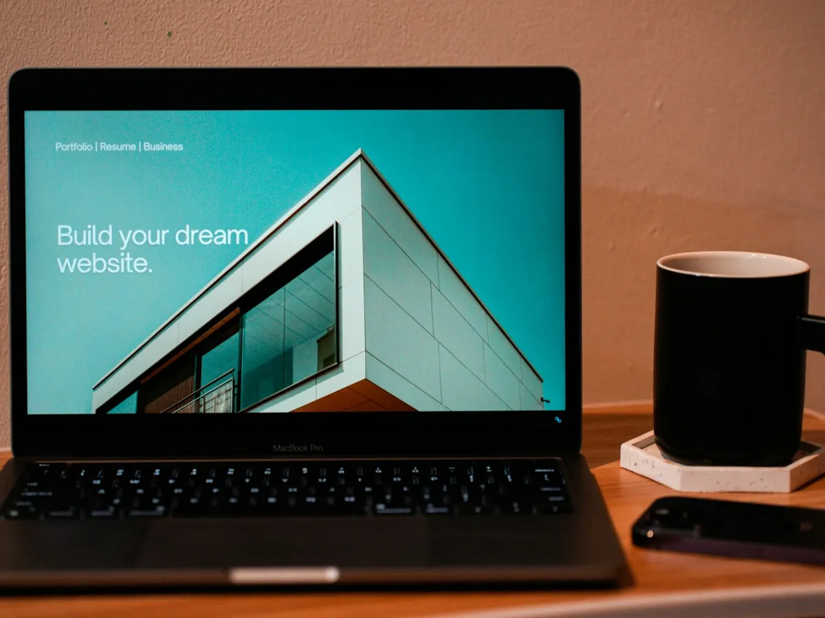 A laptop on a desk showing a website