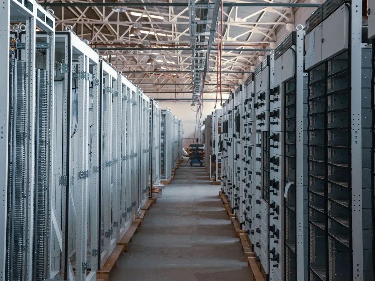 An aisle of server racks in a data centre