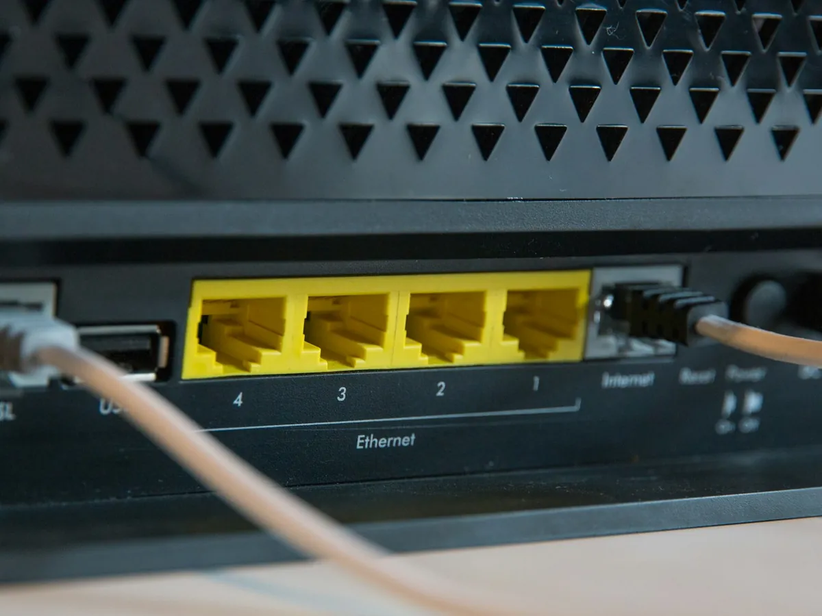 Network cables plugged into the ports of a router